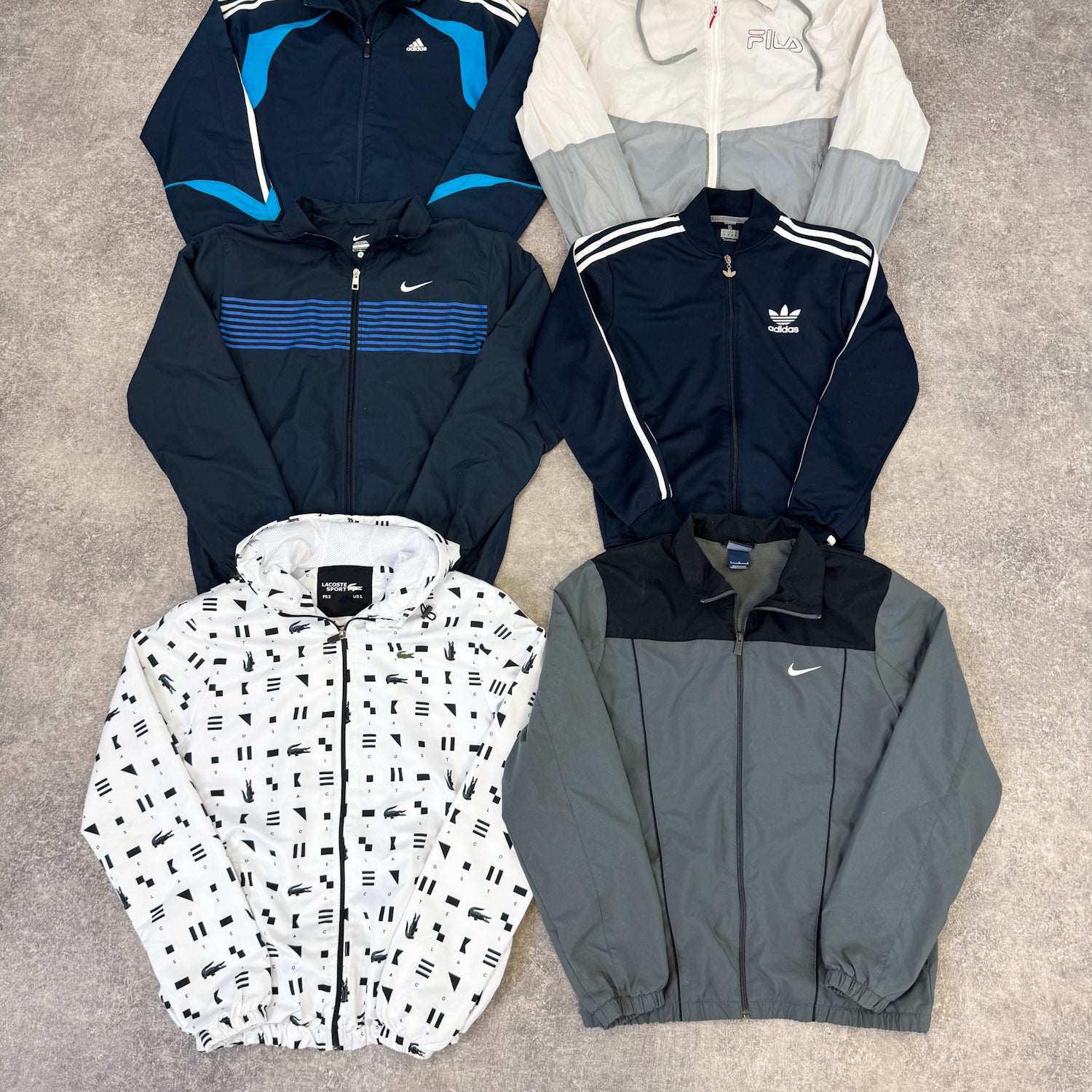 veste-de-sport-homme-femme-marque-brand-adidas-nike-lacoste-ralph-lauren-reebok-puma-moderne-vintage-vetement-grossiste-friperie-wholesaler-seconde-main-marque-occasion-textile-piece-80-90-2000-2010-french-pick